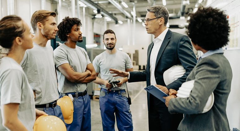 Company,Inspector,Taking,A,Tour,In,Industrial,Plant,And,Communicating